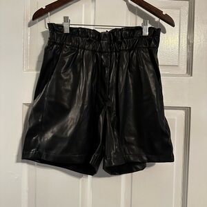 Black faux leather shorts
